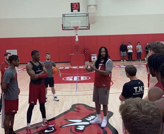 Waka Flocka Flame speaks to the Arkansas Razorbacks men's basketball team after practice.